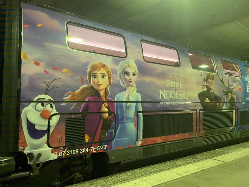 A TGV train adorned with scenes and characters from the beloved frozen fairy tale "La Reine des Neiges.