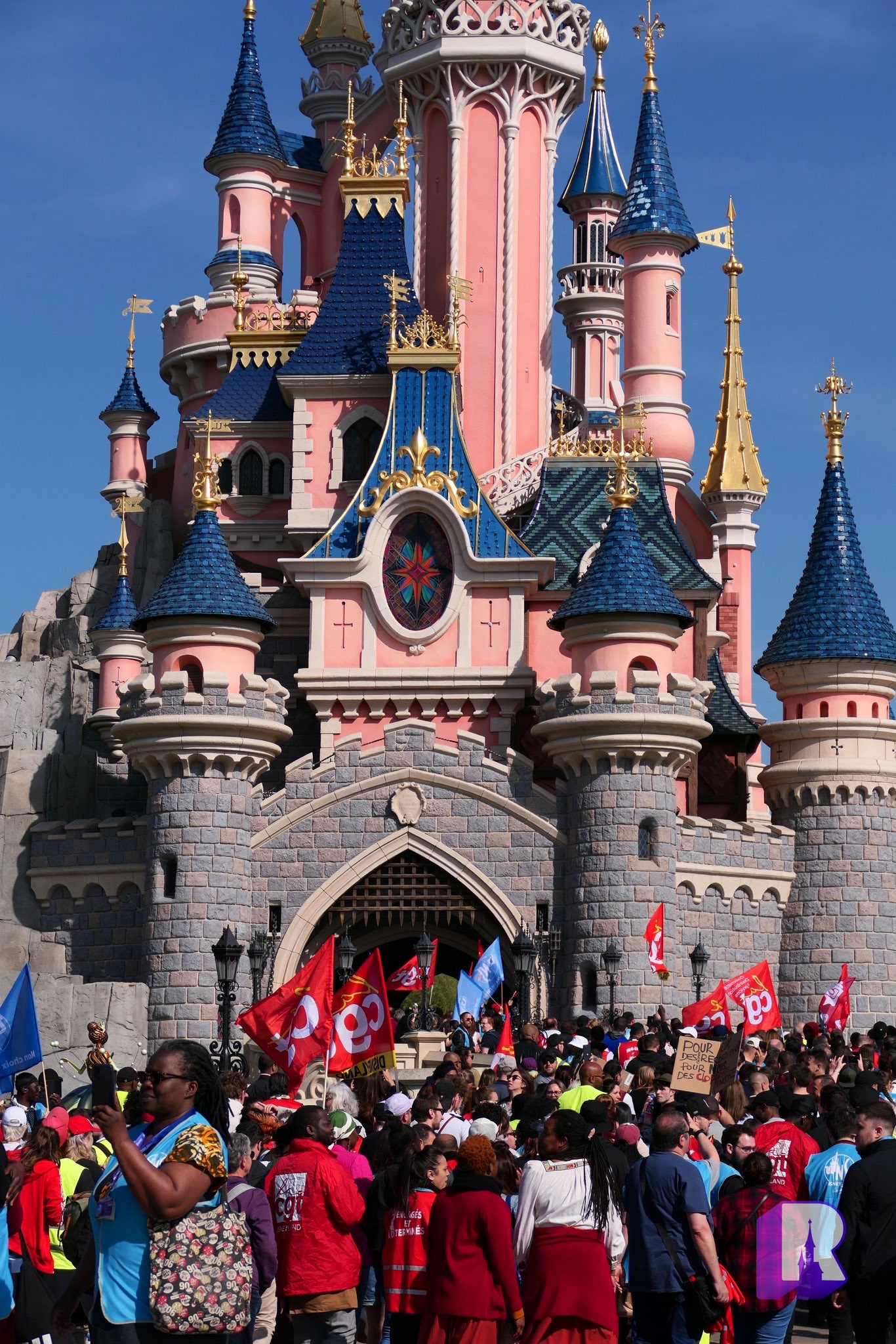 disneyland paris castle with cast members on strike